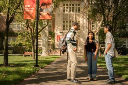 Students standing outside of Knoles Hall.