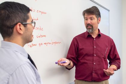 Dr. Ed Rogan with student in classroom