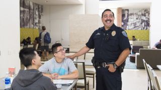 a public safety office talks to students