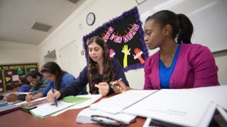 Students work in a professional writing course.