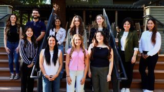 nutrition students stand on stairs