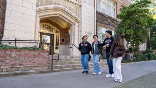 students walk near knoles hall