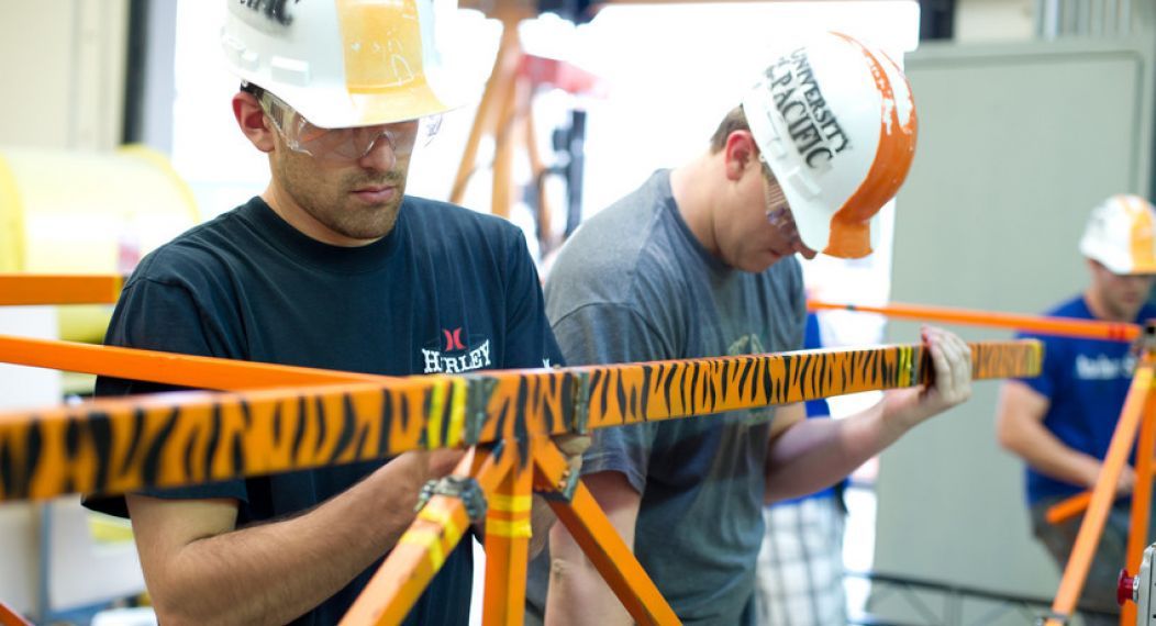 Students building a bridge. 