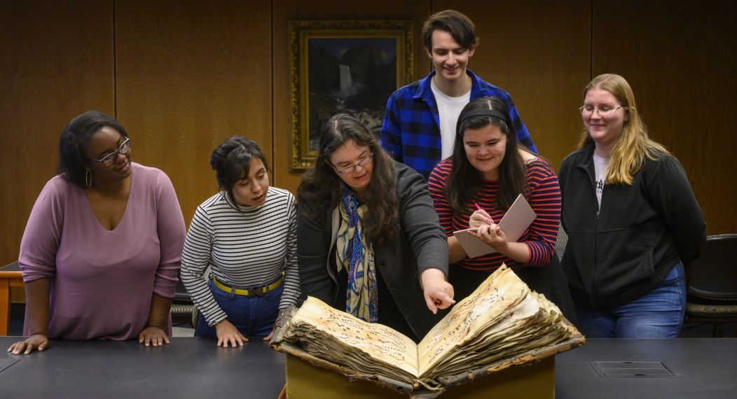 music history professor and students in library