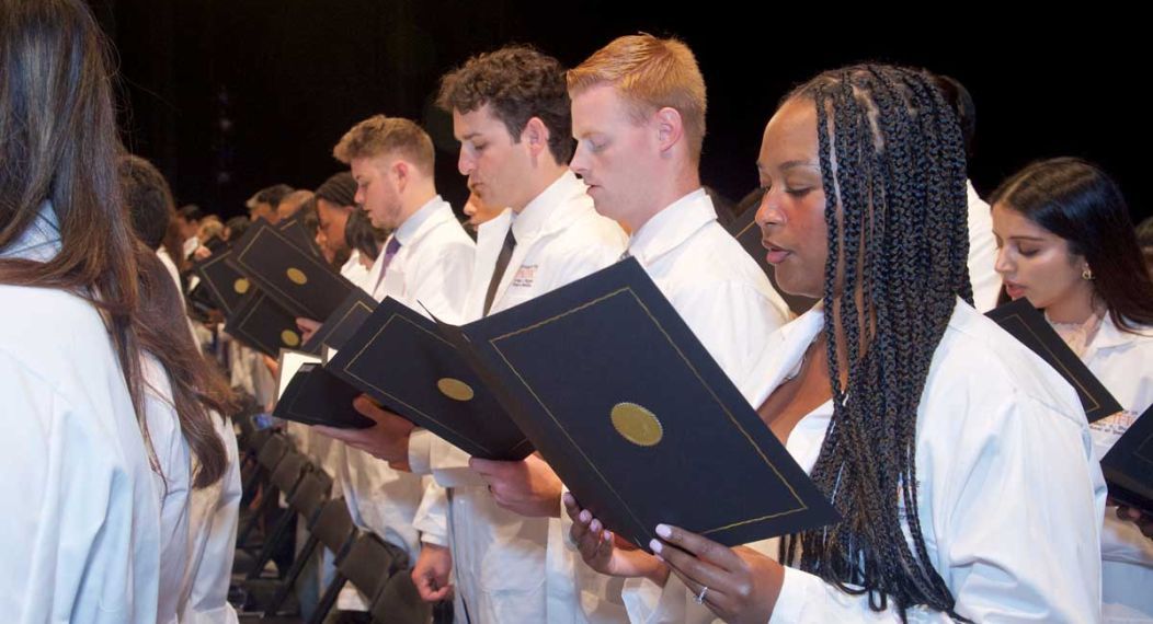 Students reciting oath at White Coat Ceremony
