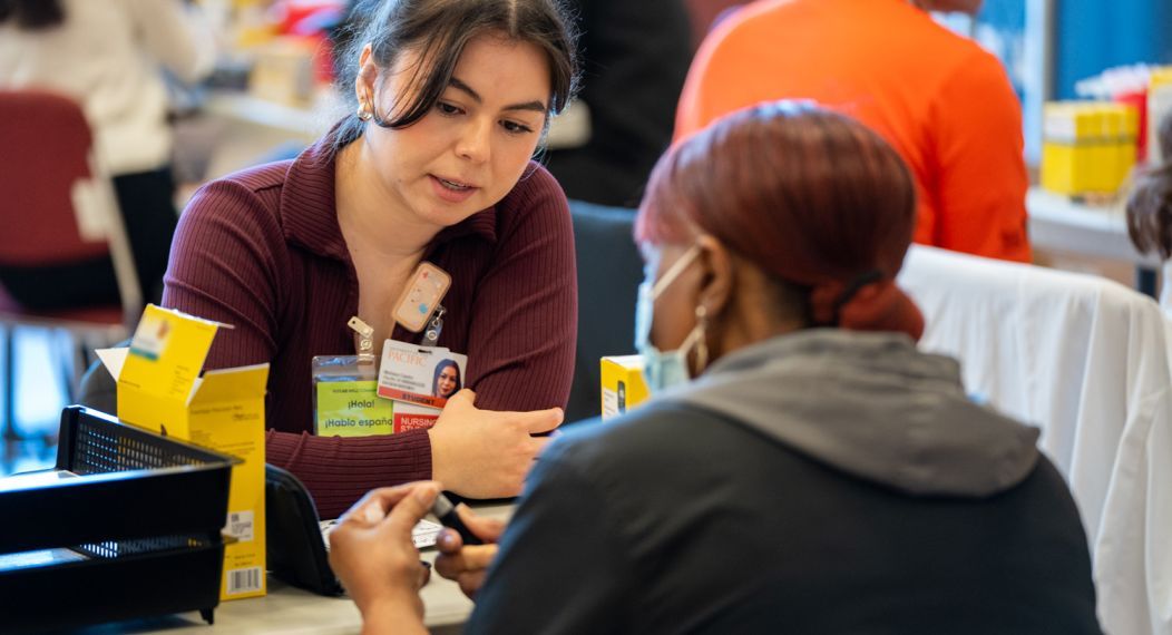 Doctor of pharmacy student with patient at diabetes clinic