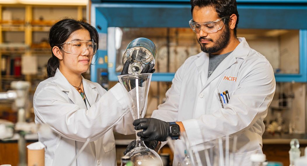 Two students working in a research lab