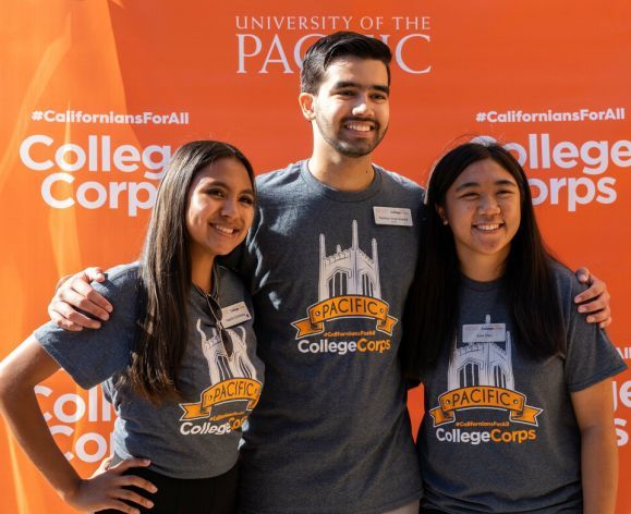 a group of Pacific students wearing College Corps shirts