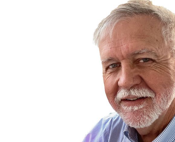 A man smiles for a photo