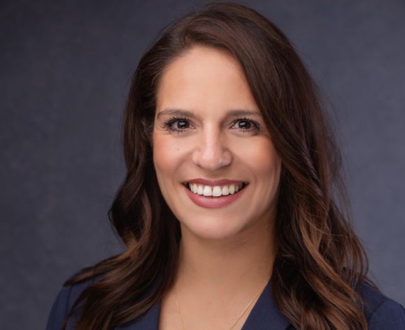 A portrait of a woman in a suit