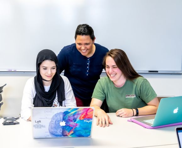 Dr. Laura Hallberg with 2 students