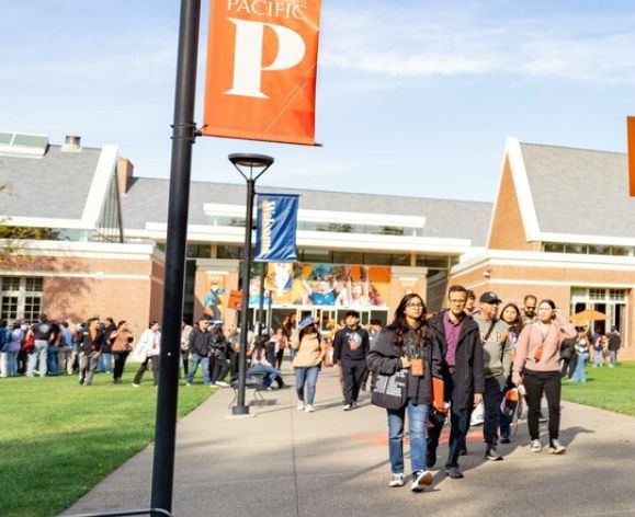 students walking in front of the derosa university center