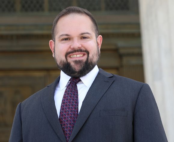A portrait of a man in a suit