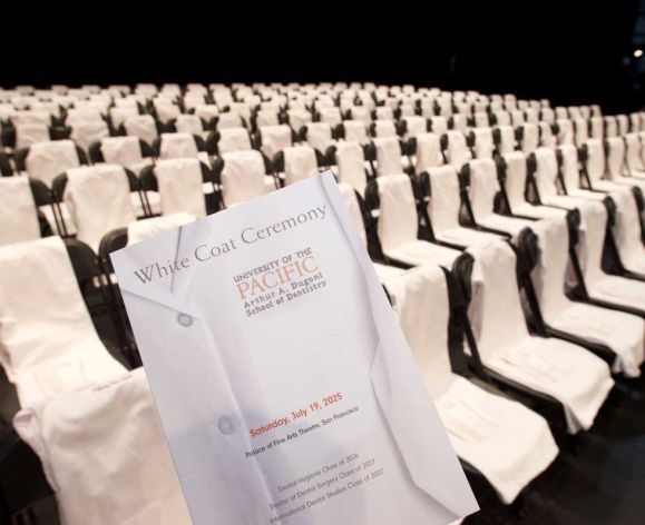 cover of White Coat Ceremony program with chairs in background
