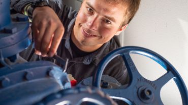 Student turning wheels