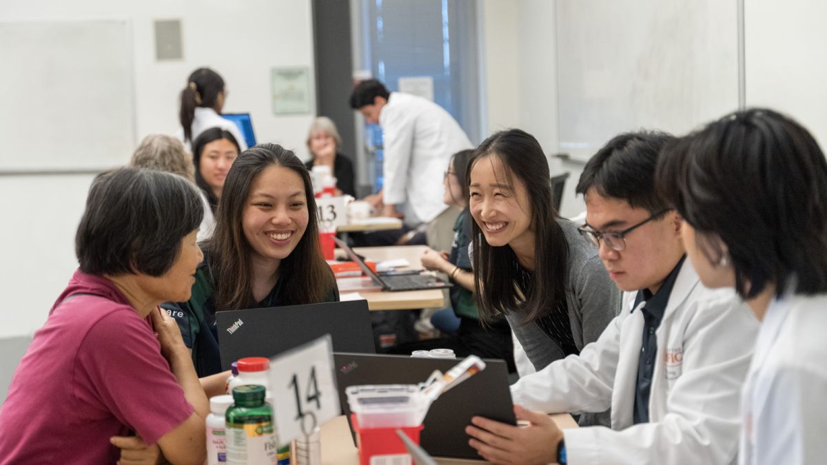 PharmD students with patients at a health care outreach clinic