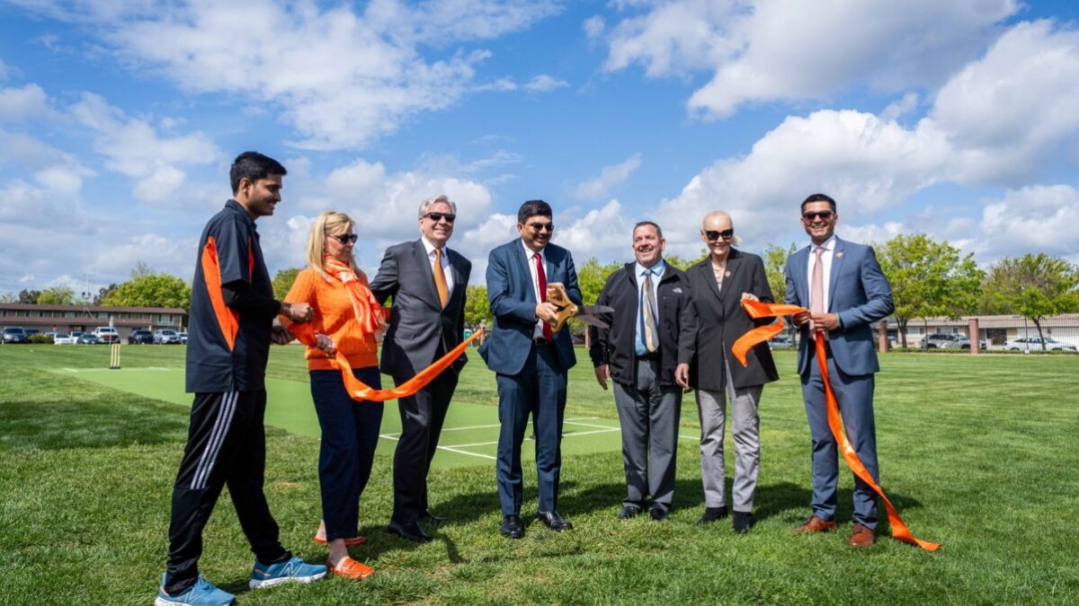 Pacific President Christopher Callahan and others at the ribbon cutting ceremony for the new cricket field.